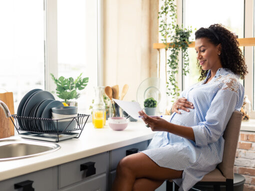 pregnant woman reading tips on phone